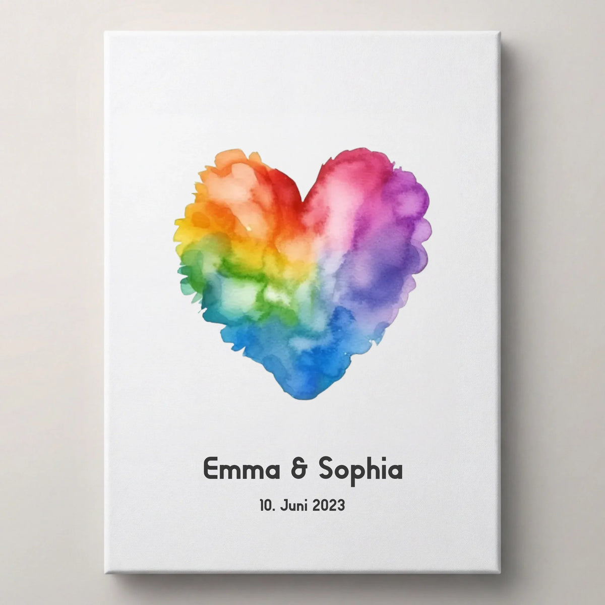 Gästebuch Leinwand mit Regenbogenherz, Name Emma und Datum 10. Juni 2023 in dunkler Schrift