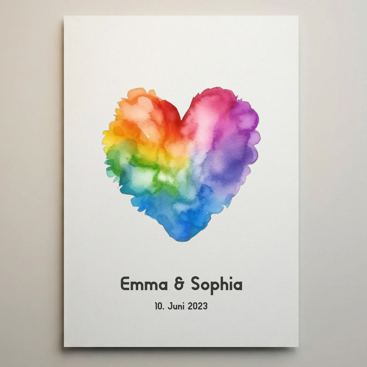 Gästebuch mit Herzmotiv in Regenbogenfarben, darunter Name Emma und Sophia sowie Datum 10. Juni 2023