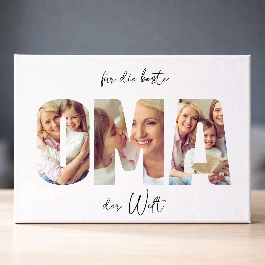 Weiße Leinwand mit Familienfotos in großen Buchstaben und dem Schriftzug für die beste Oma der Welt